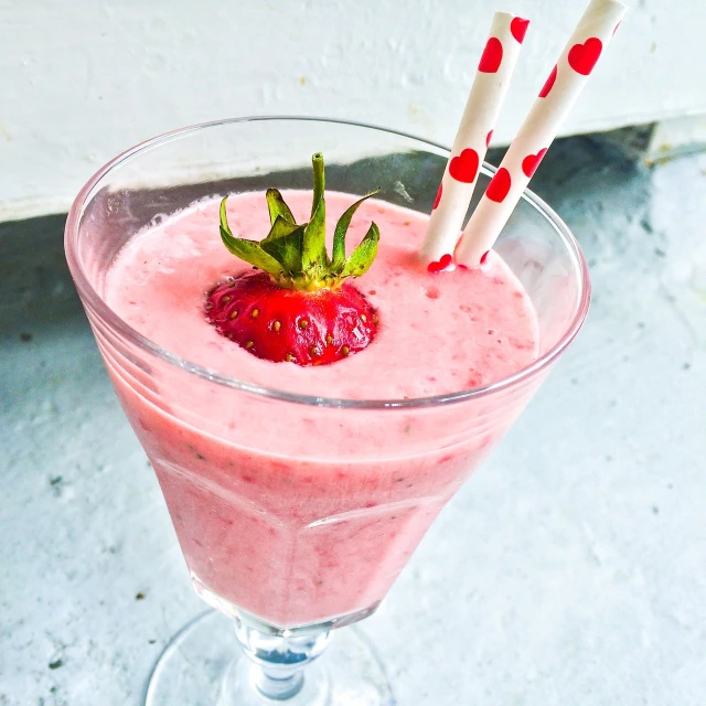 a close up of a drink with strawberries in it, a portrait, milkshake, seventies, refreshing colour, dish