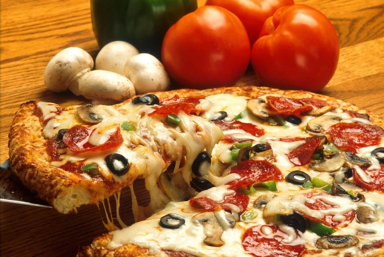 a pizza sitting on top of a wooden table, a picture, by Arthur Pan, realism, h 768, high grain, veggies, sales