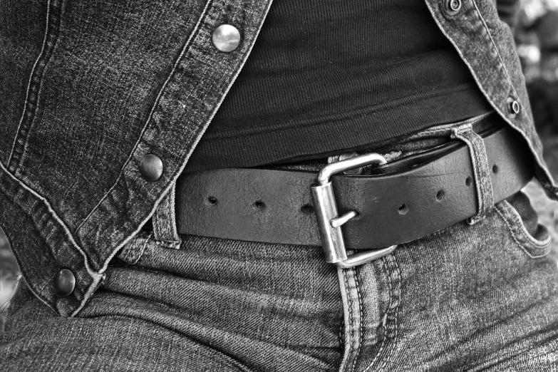 a close up of a person wearing a belt, a stock photo, inspired by Larry Fink, leather jacket and denim jeans, ambient occlusion:3, industrial photography, closeup view