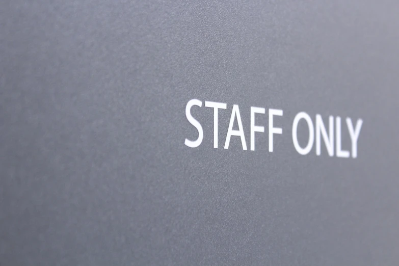 a close up of a sign that says staff only, a poster, flickr, ultrafine detail, slate, corporate style, side profile shot