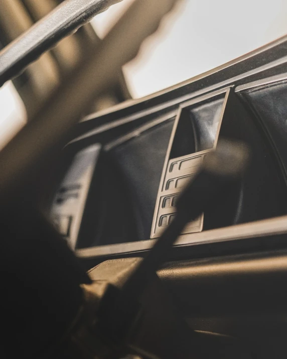 a close up of the dashboard of a car, by Thomas Häfner, unsplash, digital art, cassette, bmw m1, close up shot from the side, candid portrait photo