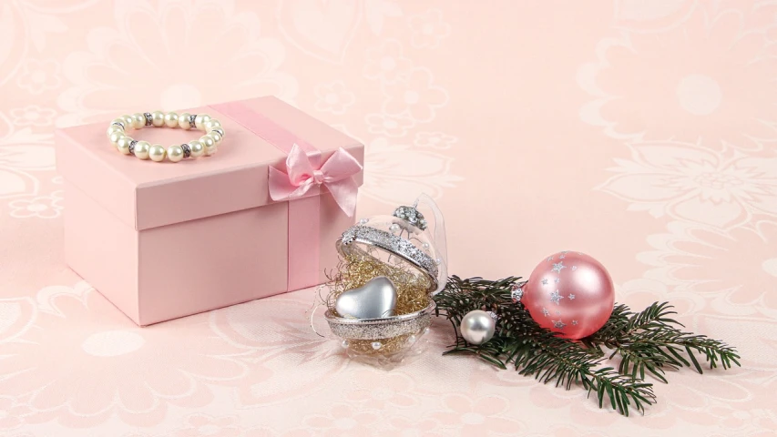 a pink gift box sitting on top of a table, a picture, silver ornaments, 3 4 5 3 1, anastasia ovchinnikova, mini