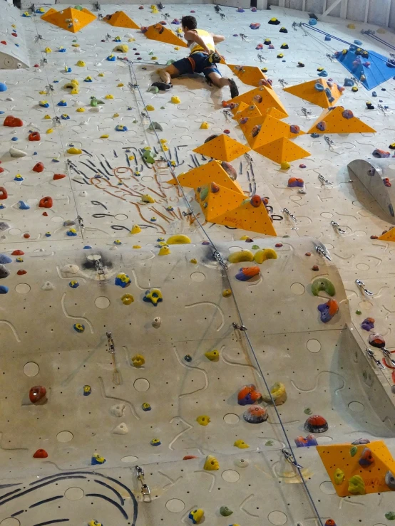 a man sitting on top of a climbing wall, a photo, figuration libre, pov photo, lots of details, 2 0 2 2 photo, slightly blurry
