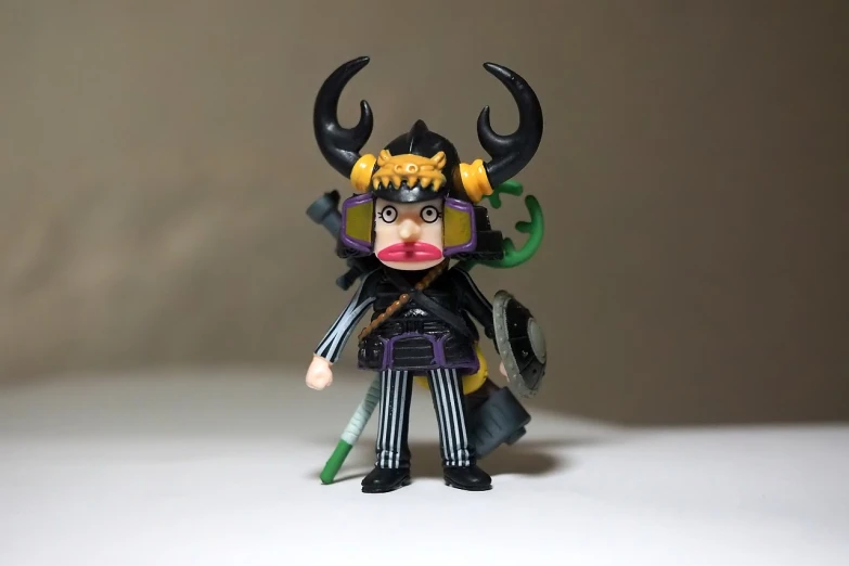 a close up of a toy on a table, inspired by Eiichiro Oda, shin hanga, horned god, full body shot!!, happy meal toy, samurai outfit