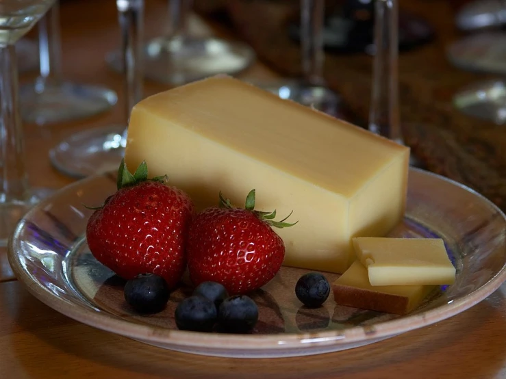 a plate of cheese, strawberries, and blueberries, renaissance, slice of life”, award-winning details”, shiny skin”, depth of field”