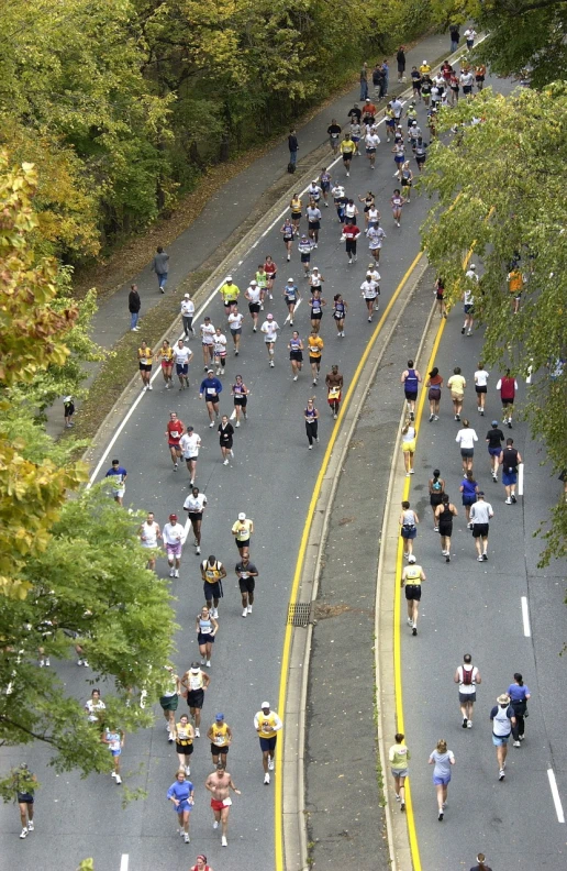 a large group of people running down a street, a picture, flickr, y2k”, from 1 0 0 0 feet in distance, serpentine curve!!!, boston