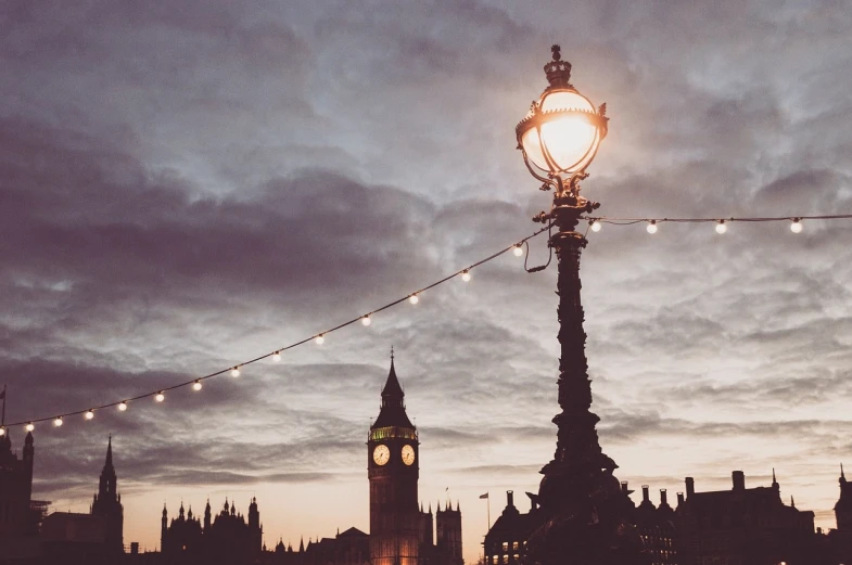 the big ben clock tower towering over the city of london, unsplash contest winner, romanticism, lamp posts, muted lights, atmospheric ”