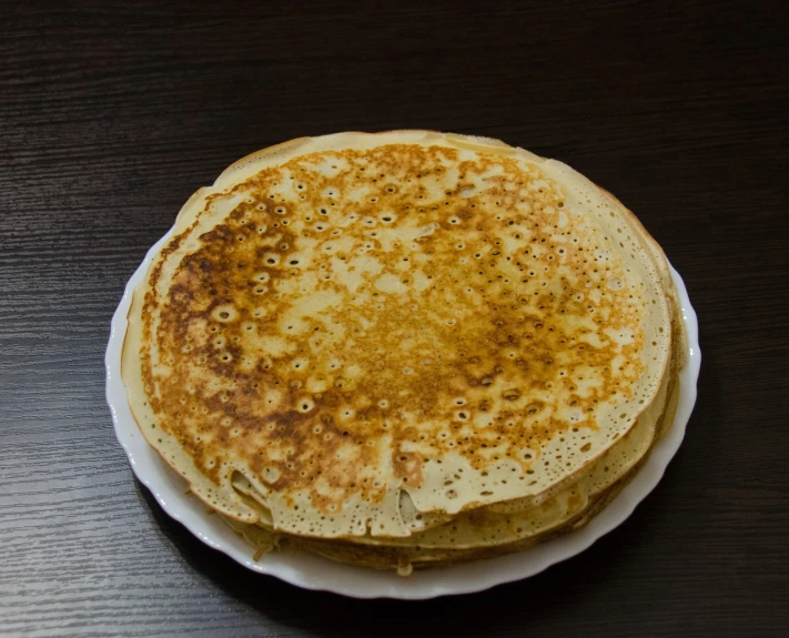 a stack of pancakes sitting on top of a white plate, by Aleksander Gierymski, 2 1 0 mm, gauze, slavic, fan favorite