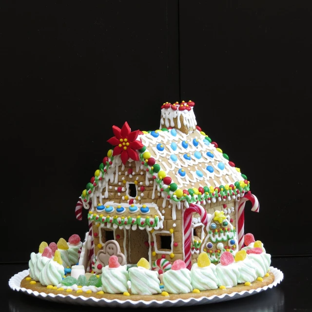 a decorated gingerbread house sitting on top of a table, by James Warhola, renaissance, photorealistic detailed, on black background, - h 1 0 2 4, a brightly colored