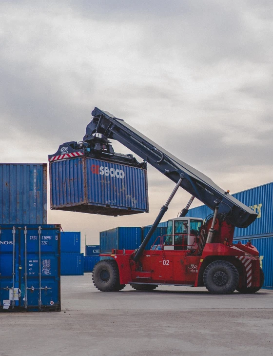 a crane is lifting a container onto a truck, a portrait, by Daniel Schultz, pexels, figuration libre, 🕹️ 😎 🔫 🤖 🚬, inspect in inventory image, hou china, beauty shot