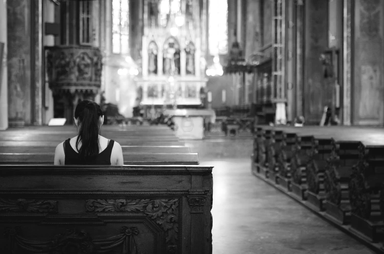 a woman sitting on a pew in a church, a picture, by Matthias Weischer, pexels, fine art, back and white, on the altar, beautiful lonely girl, 15081959 21121991 01012000 4k