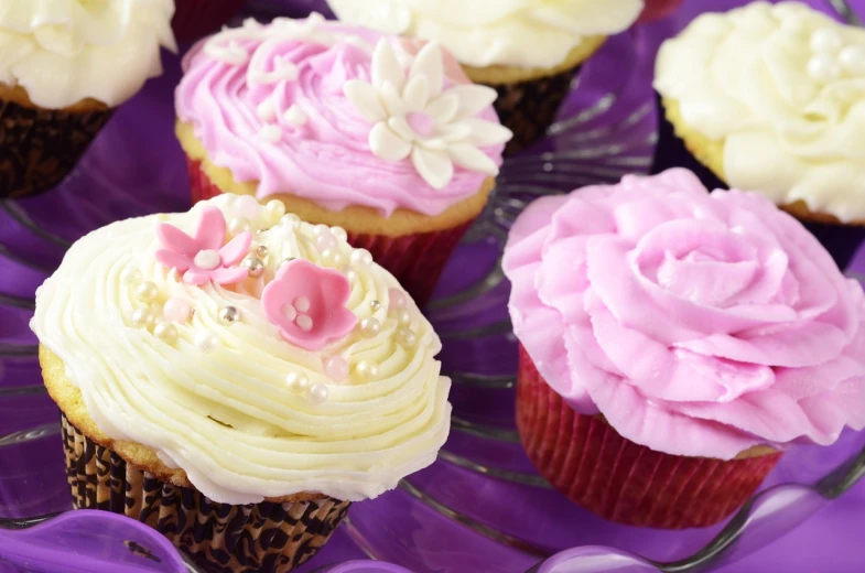 a close up of a plate of cupcakes with frosting, romanticism, pink and purple, detailed zoom photo, floral bling, medium detail