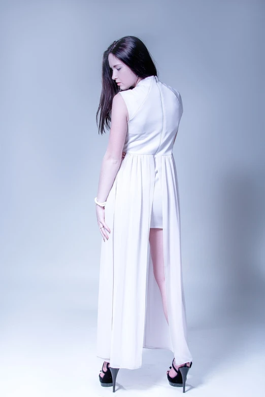 a woman in a white dress posing for a picture, inspired by Esaias Boursse, tumblr, professional studio photography, rear-shot, product introduction photo, jumpsuit