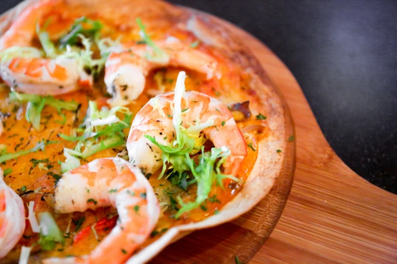 a pizza sitting on top of a wooden cutting board, inspired by Géza Dósa, hurufiyya, prawn, vibrant luminescence, bao phan, mid closeup