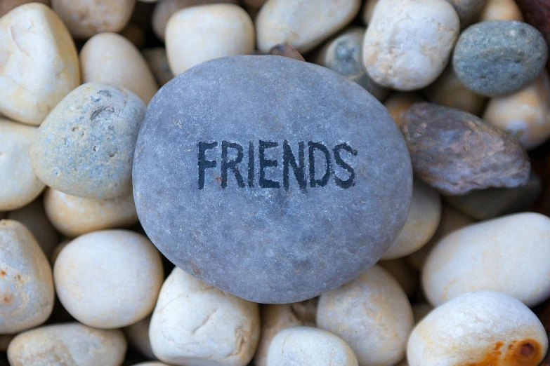a stone with the word friends written on it, flickr, avatar image, istockphoto, gravels around, social media