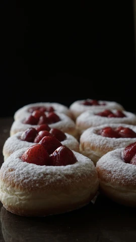 a table topped with pastries covered in powdered sugar, inspired by Modest Urgell, unsplash, romanticism, strawberry, ffffound, closeup!!!!!!, tartakovsky