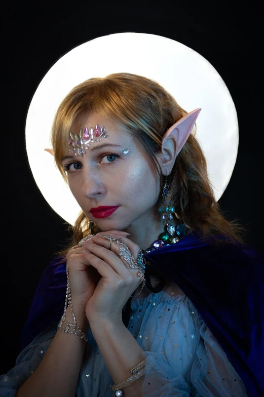 a woman dressed as a elf poses for a picture, a character portrait, renaissance, sci - fi jewellery, moonbeams, promo photo, intricate led jewellery