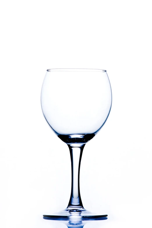 a wine glass sitting on top of a table, a stock photo, minimalism, high detail product photo