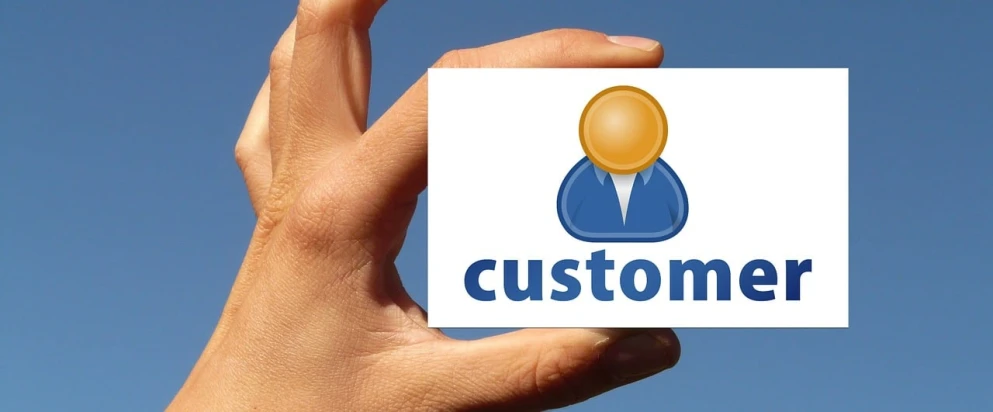 a hand holding a business card that says customer, by Matthias Stom, pixabay contest winner, purism, logo for a social network, wikimedia commons, avatar, restomod