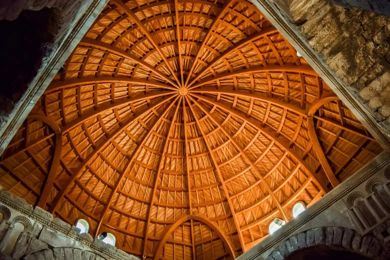 a large wooden dome in a stone building, by Thomas Häfner, shutterstock, romanesque, taken with sigma 2 0 mm f 1. 4, orange roof, ceiling, !! very coherent!!