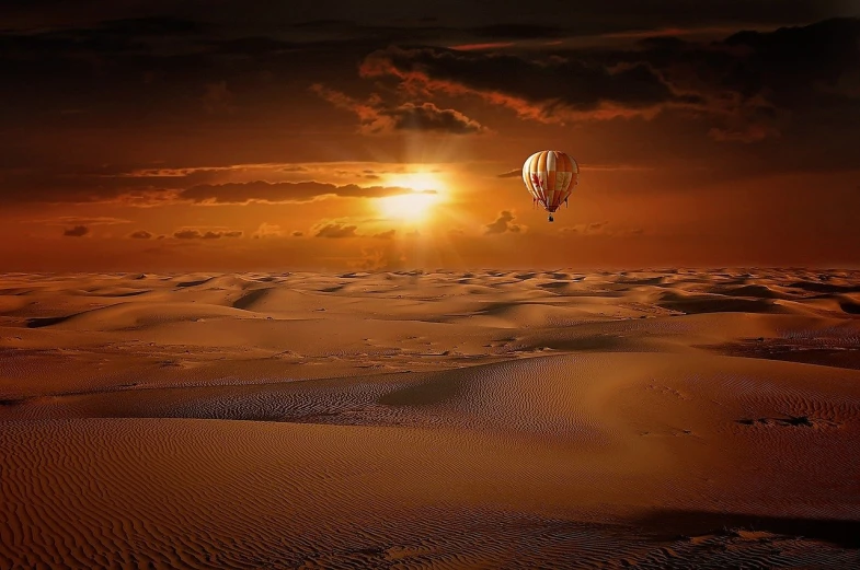 a hot air balloon flying over a desert, digital art, inspired by Phil Koch, pixabay contest winner, sand sea, beautiful sunrise, in the desert beside the gulf, beige and dark atmosphere