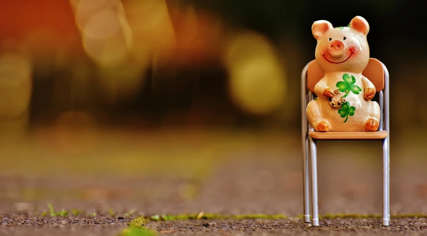 a figurine of a pig sitting on a chair, a picture, unsplash, realism, toy photo, outdoor photo, winnie the pooh, wide image