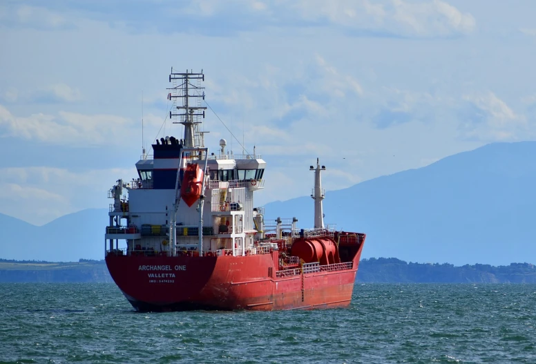 a large red boat floating on top of a body of water, a photo, michael angelo, technical, victoria, alexandros pyromallis