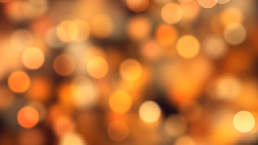 a blurry image of a bunch of oranges, by Zofia Stryjenska, shutterstock, digital art, brown and gold color palette, bokeh!, abstract lighting, vector background
