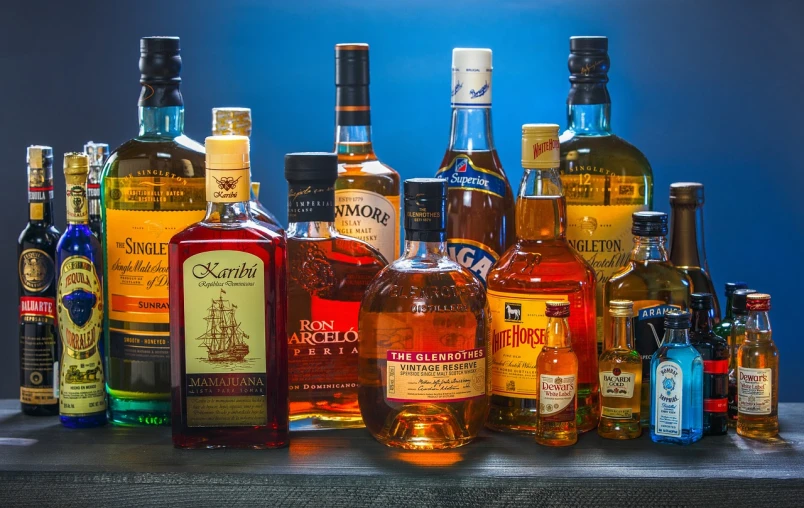 a bunch of liquor bottles sitting on top of a table, a portrait, by Matt Stewart, shutterstock, rum, highly detailed product photo, full product shot, test