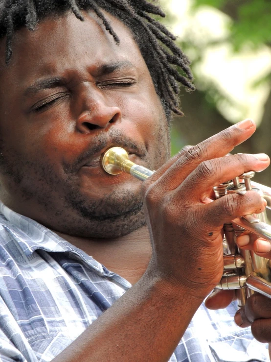 a man with dreadlocks playing a trumpet, a portrait, by Paul Davis, flickr, warm weather, 3 jazz musicians, dynamic closeup, bayou