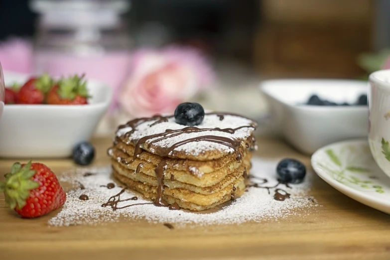 a stack of pancakes sitting on top of a wooden table, romanticism, 🎀 🗡 🍓 🧚, rectangular, bogna gawrońska, stroopwaffel