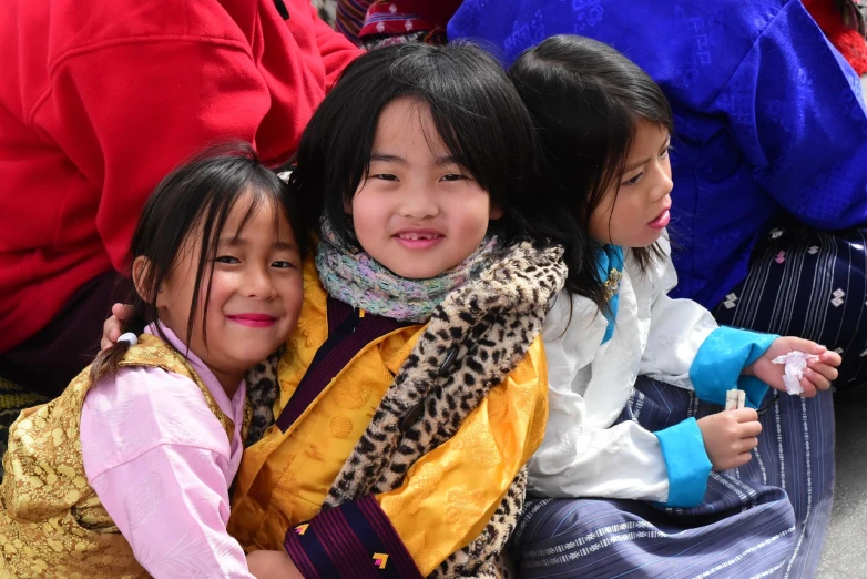 a group of young girls sitting next to each other, a picture, by Sam Dillemans, flickr, quito school, bhutan, square, yellow dragon head festival, 2024