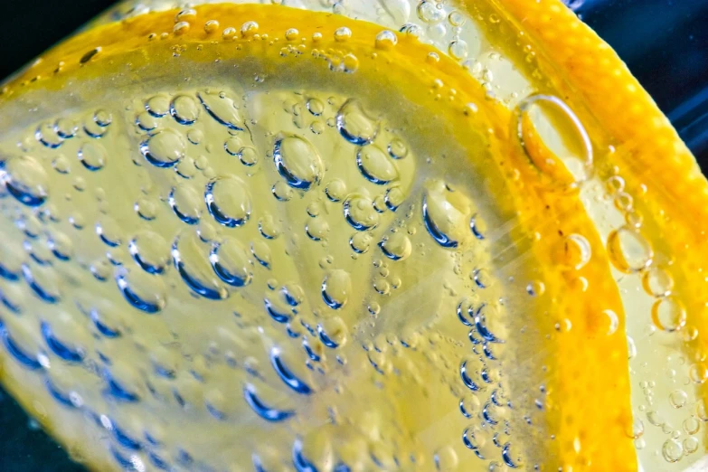 a close up of a slice of lemon, a macro photograph, lyrical abstraction, bubbles, slush))