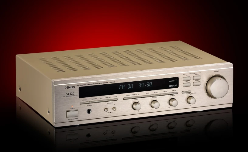 a silver radio sitting on top of a black table, a stock photo, by Denis Eden, 7 0 s hi fi system, high detail product photo, denoised, cover shot