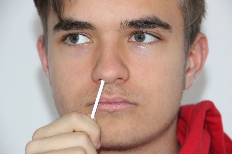 a man with a toothbrush in his mouth, a hyperrealistic painting, by John Luke, reddit, hyperrealism, cute bandaid on nose!!, dezeen, magnus carlsen, false human features