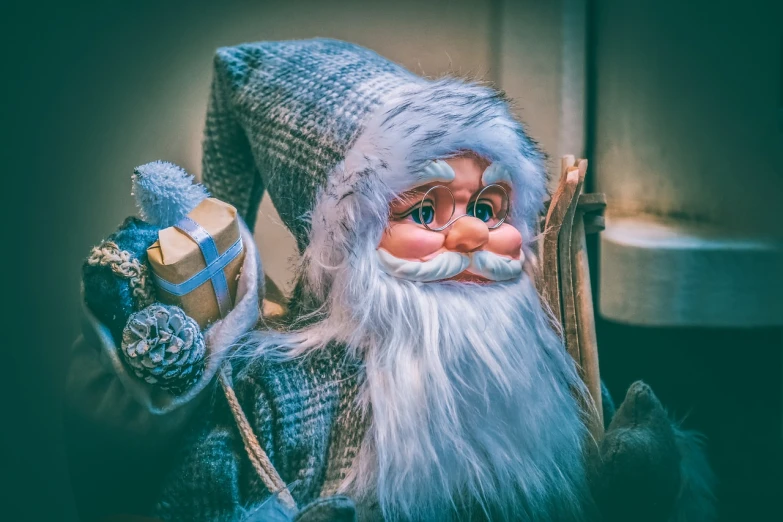 a close up of a figurine of a santa claus claus claus claus claus claus claus claus claus claus claus claus claus claus claus claus claus, by Aleksander Gierymski, pixabay contest winner, digital art, blue toned, 2019 trending photo, blue'snappy gifts'plush doll, old gigachad with grey beard