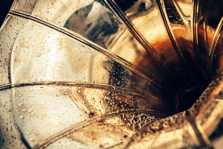 a silver gramphone sitting on top of a table, a macro photograph, by Anita Kunz, abstract illusionism, dirty old golden metal, fan art, glass texture, tuba