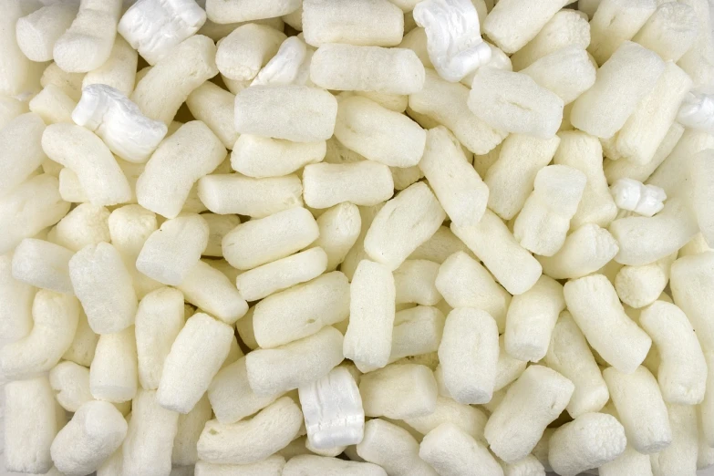a pile of bananas sitting on top of a table, a pastel, plasticien, close up of single sugar crystal, white sleeves, body made out of macaroni, fine texture detail