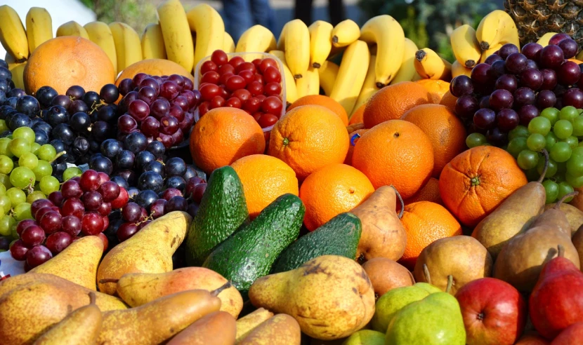 a table topped with lots of different types of fruit, by Karl Völker, pexels, full of colour 8-w 1024, panel, banana, full of colour w 1024