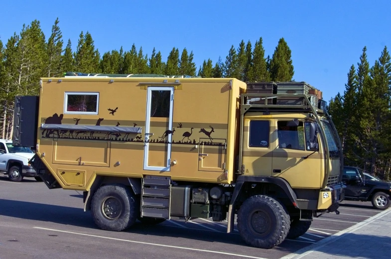 a yellow truck is parked in a parking lot, by Petr Brandl, dau-al-set, raptor, trecking, rv, olive