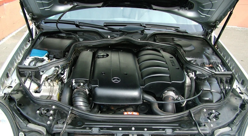 the engine compartment of a mercedes benz benz benz benz benz benz benz benz benz benz benz benz, a picture, by Ella Guru, flickr, 2006 photograph, performance, full-body-shot, black color scheme