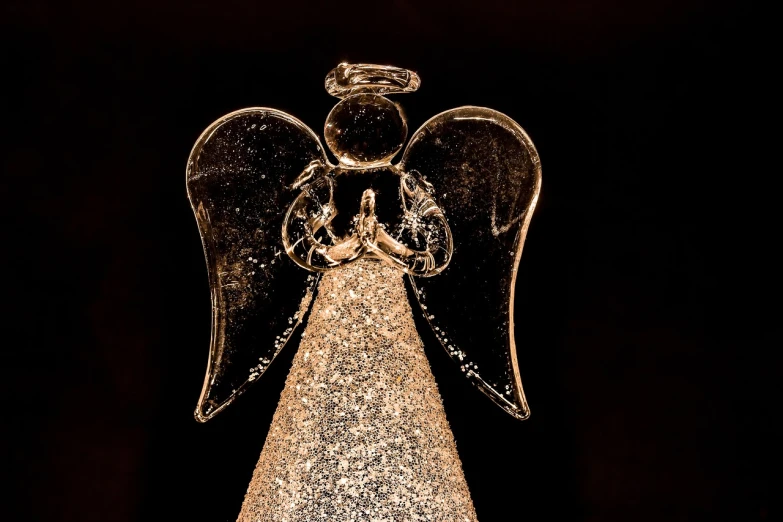 a glass angel sitting on top of a christmas tree, a stipple, by Linda Sutton, pexels, visual art, 7 0 mm. dramatic lighting, - h 1 0 2 4, macro 20mm, angel's trumpet