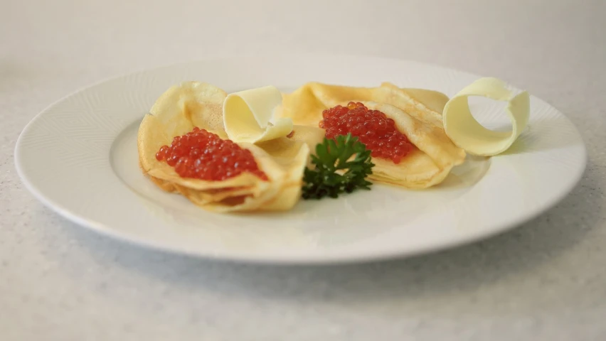 a close up of a plate of food on a table, red caviar instead of sand, pancakes, johannen voss, square