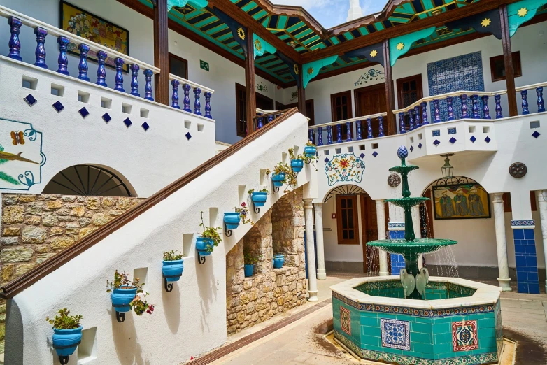 a building with a fountain in front of it, by Riad Beyrouti, shutterstock, in chuquicamata, stairs to an upper floor, usa-sep 20, house interior