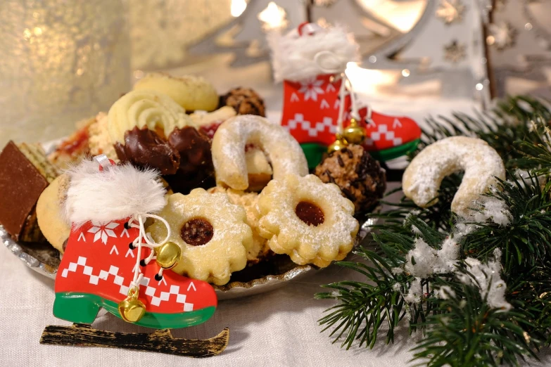 a plate of cookies sitting on top of a table, by Aleksander Gierymski, wearing festive clothing, close-up product photo, gifts, vienna