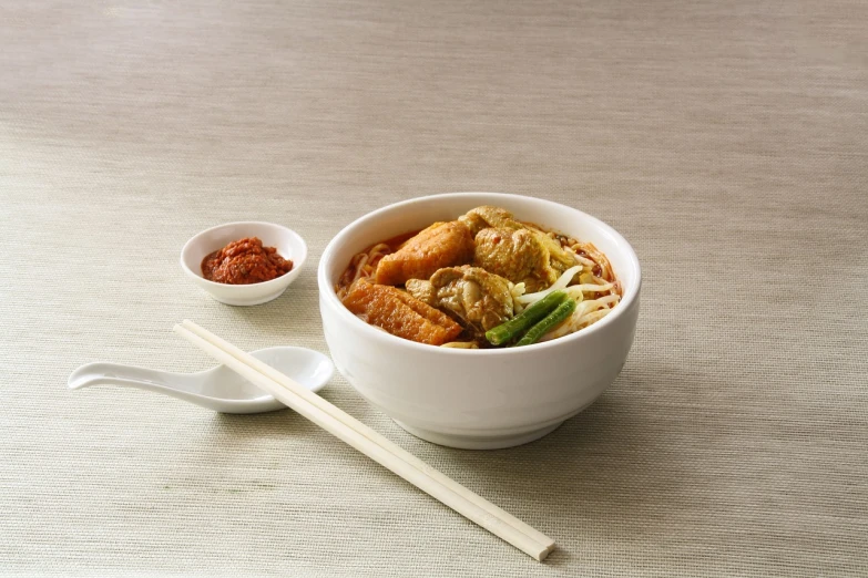 a close up of a bowl of food with chopsticks, a picture, dau-al-set, product introduction photo, malaysian, bo chen, 1