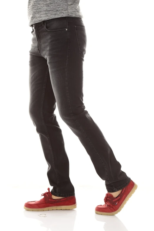 a man standing with a cell phone in his hand, by Rodney Joseph Burn, realism, black extremely tight jeans, profile view perspective, fullbody photo, packshot