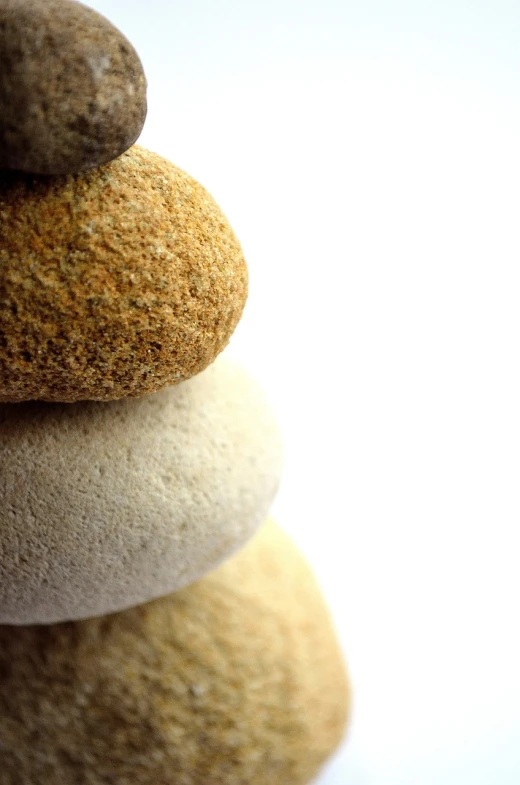 a stack of rocks sitting on top of each other, a macro photograph, minimalism, iphone wallpaper, illustration!, ultrafine detail ”