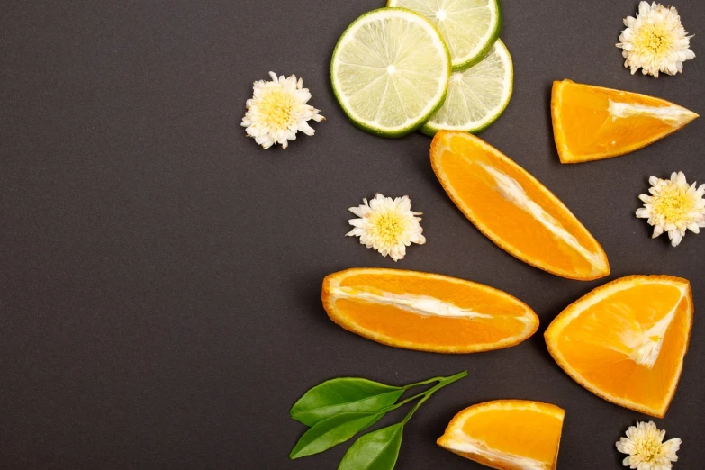 slices of oranges, limes, and flowers on a black surface, inspired by Cornelis de Heem, pexels, minimalism, background image, perfume, istock, cool marketing photo