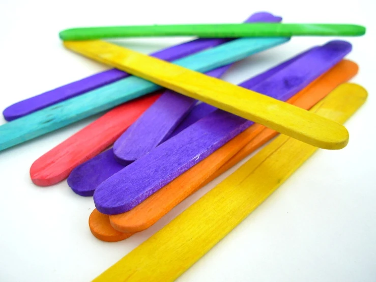 a pile of pops sticks sitting on top of a table, a picture, flickr, bright colours, spatula, gold green and purple colors”, full of colour 8-w 1024